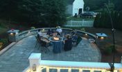 family and friends around brick fire pit